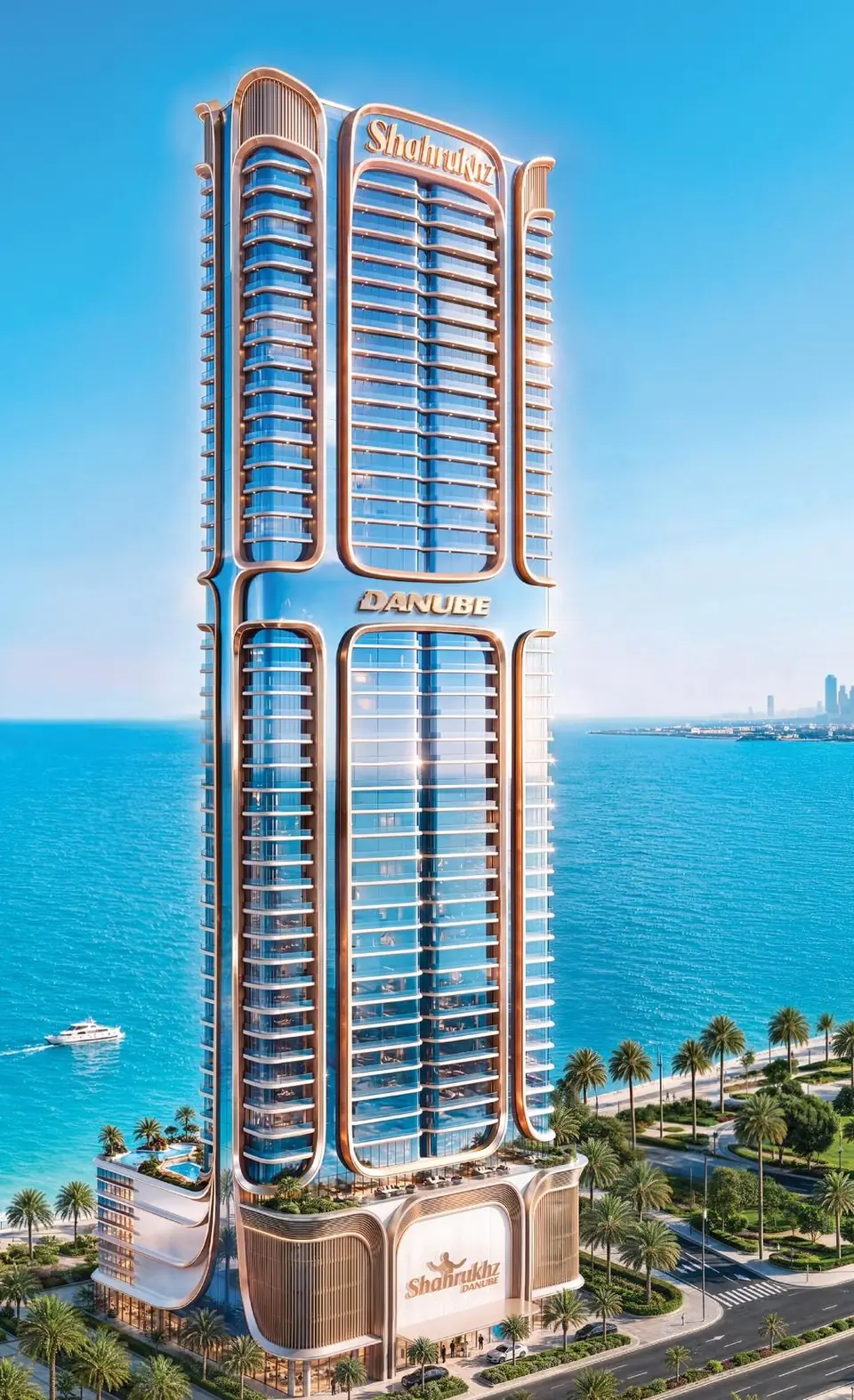 The Shahrukhz Residences tower rising beside the sea in daylight