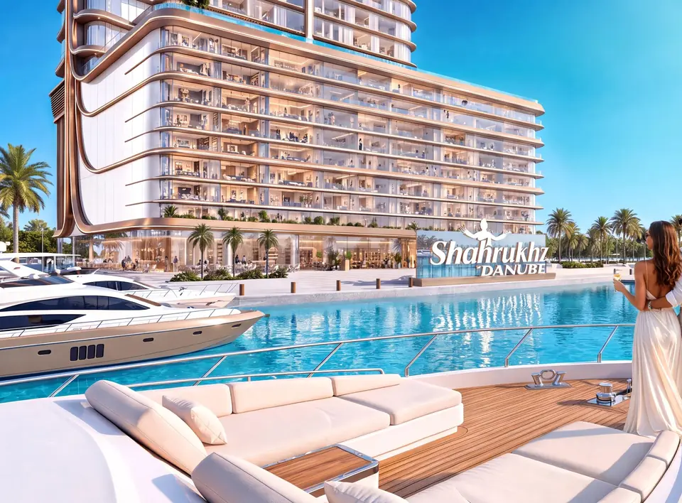 A couple on a yacht deck in the marina beside the Shahrukhz Residences tower